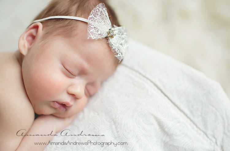 newborn girl with white bow boise idaho