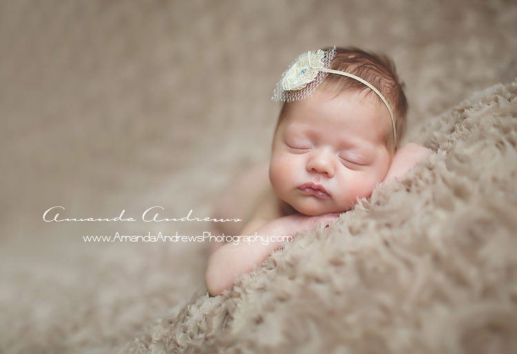 newborn sleeping on brown blanket boise idaho