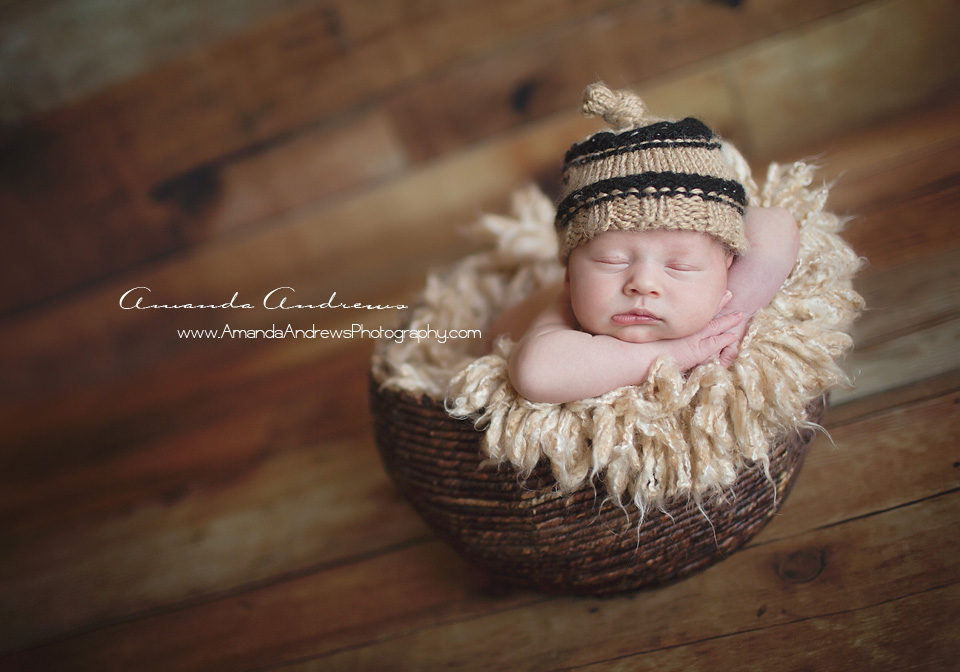 baby sleeping in basket