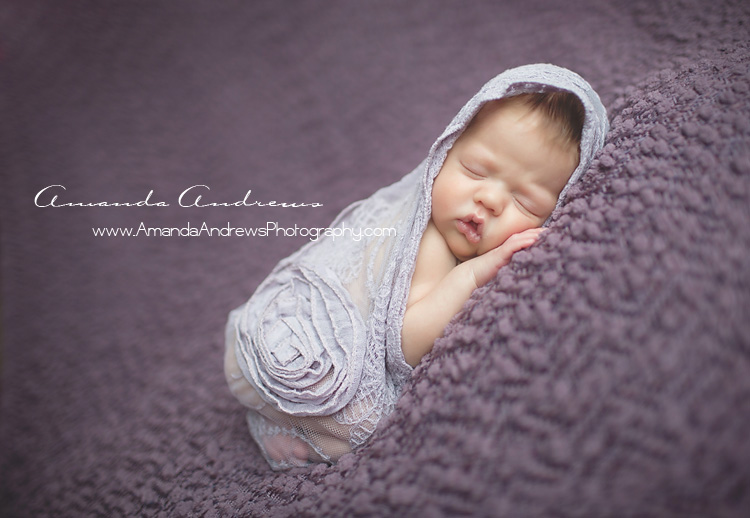 sleeping infant wrapped in purple boise idaho